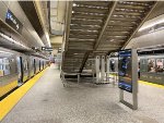 At 96th St Station, the Holiday Arnine Set sits on the right and on the left is a regular Q train set